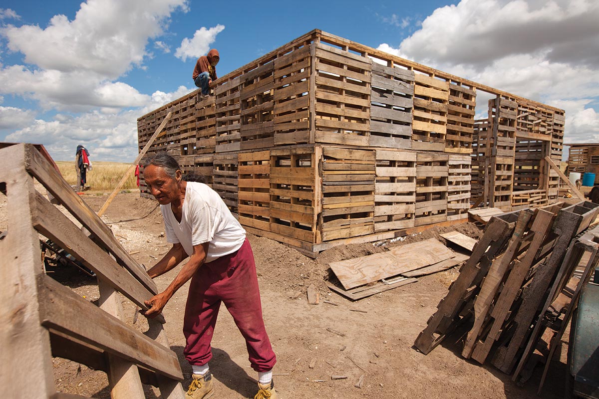 man building house